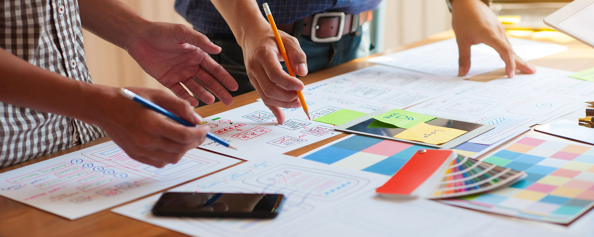 designers looking at colour swatches on a desk