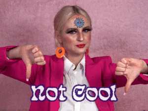 girl shaking her head with thumbs down in a ooink blazer with orange hoop earrings, text overlay saying not cool