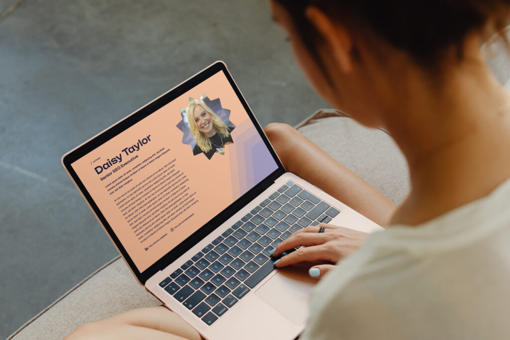 An example author page with a profile picture, name and bio open on a lady's lap.